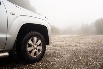 Fototapeta na wymiar Offroad car concept with mountains, mountain and fog. foggy road