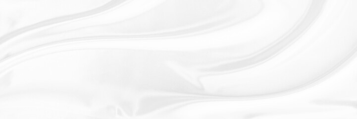 White gray satin texture that is white silver fabric silk panorama background with beautiful soft blur pattern natural.