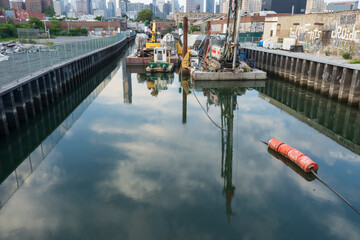 The Gowanus Canal in the Gowanus Neighborhood of Brooklyn,  Barges and Buoy in Canal, Brooklyn, NY, USA.