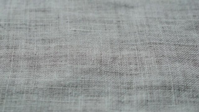 Closeup natural linen texture background. Abstract thread pattern on a linen fabric