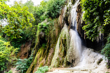 Fototapeta na wymiar Clocota Waterfall, located on the edge of the spa resort Geoagiu-Bai in Hunedoara County and is one of the most beautiful in the county. Romania.