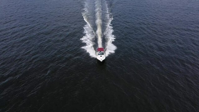 Walking sea boat floats in the sea.