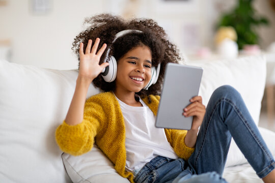 Cute african american child having online party with friends