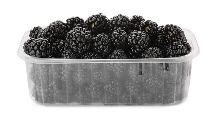 Tasty ripe blackberries in plastic container isolated on white