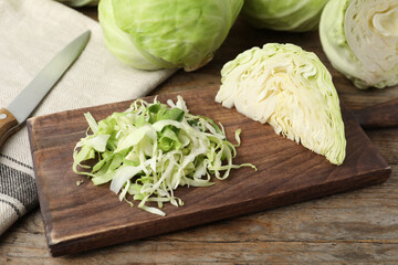 Chopped ripe white cabbage on wooden table