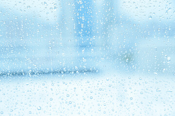 Raindrops on window glass close-up.