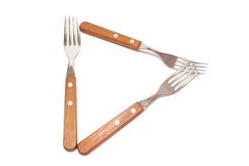 3 forks with wooden handles making the letter D on a white background
