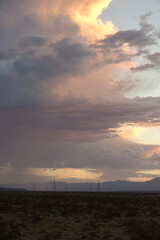 Cloudburst at sunset over the Inyo desert plains