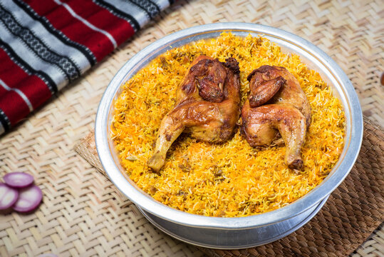 Arabian Mutabbaq chicken Samak rice or Motabaq Chicken served in dish top view of middle east food