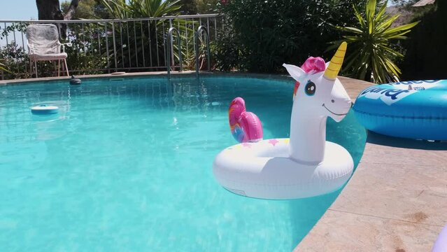 inflatable circle in the form of a unicorn in the pool