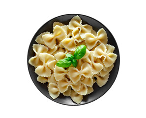 Farfalle, cooked pasta with basil green leaves, isolated on white background with clipping path, top view.