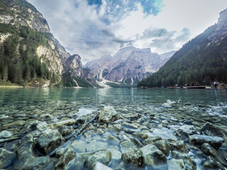 The beautiful blue and clear Lago di Braies lake in the Dolomites below the Seekofel mountain