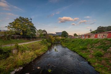 Fototapeta premium Industry part of Usti nad Labem town in summer sunset evening with Bilina river