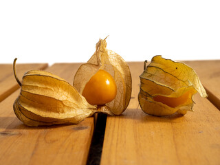 Cape gooseberry, physalis on a wooden background.