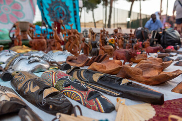 Fototapeta na wymiar African objects in a street stall during a folk festival in Italy