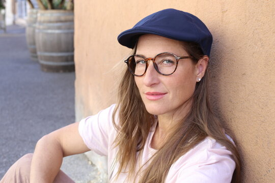 Cute woman wearing vintage style hat and eyeglasses 