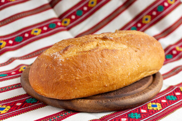 fresh white bread  on brown wood cutting board