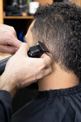 working in a barbershop, using a shaver for a haircut, personal care, beauty and style, tool...
