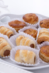 plate with salt and baked snacks, fresh bread in catering service, delicious food, details