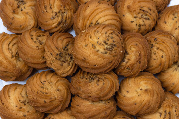 Closeup of Cookies or biscuit stacked on plate for breakfast or snacks, a healthy concept lifestyle with copy space for text isolated on white background
