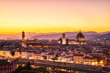 Fototapeta na wymiar Florence Aerial View at Golden Sunset over Palazzo Vecchio and Cathedral of Santa Maria del Fiore with Duomo
