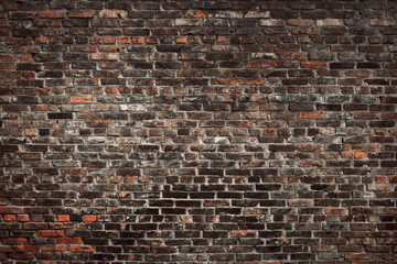 Old brown brick wall. Grunge background