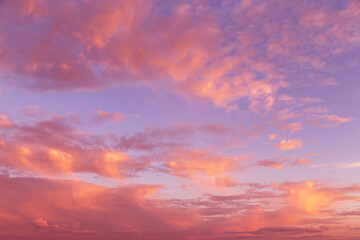 Naklejka na ściany i meble Dramatic soft sunrise, sunset pink violet orange sky with clouds background texture