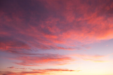 Naklejka na ściany i meble Dramatic soft sunrise, sunset pink violet orange sky with clouds background texture