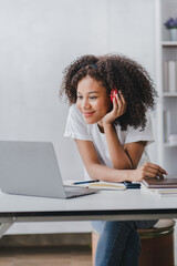 african american female students studying online using laptop online meeting