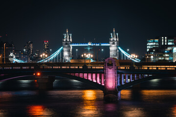 Fototapeta na wymiar Skyline of London with the tower bridge and an illuminated bridge in the foreground