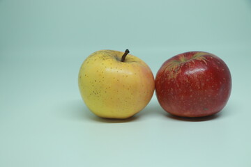 Two ripe ruddy red-yellow apple isolated on white background.