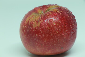 wet red apple isolated on white, red apple in water drops isolated on a white background