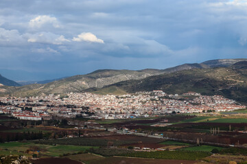 Fototapeta na wymiar Cityscape - Landscape of Selcuk city near Ephesus enlightened by sun with mountains in the distance