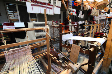Old traditional weaving loom in a household where people learn to make wool cloth, woolen stockings and other traditional clothing items from Maramures.