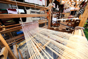 Old traditional weaving loom in a household where people learn to make wool cloth, woolen stockings and other traditional clothing items from Maramures.