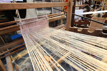 Old traditional weaving loom in a household where people learn to make wool cloth, woolen stockings and other traditional clothing items from Maramures.