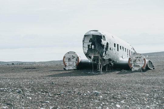 Landscape with copy space of crashed airplane in Iceland, on the beach of S&oacute;lheimasandur. Moody ambient social network image. Travel to Iceland, road trip concept. Copy space image, visit Iceland.