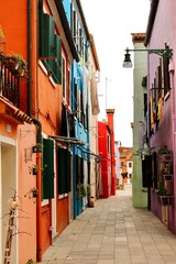 Fototapeta na wymiar Colourful street of Burano island, Italy 