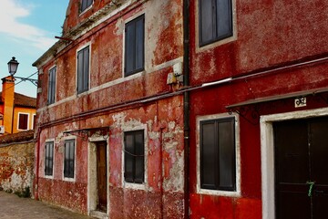Ancient red houses in Mazzorbo island, Veneto, Italy 