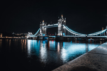 Tower Bridge at night with reflection of the lights