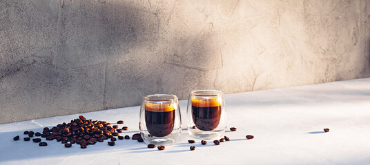 Two glass cups of espresso with coffee crema