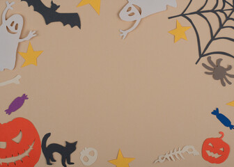 Fototapeta na wymiar Halloween round frame with funny characters on beige background. Copy space.