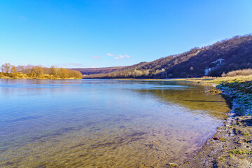 Obraz premium Beautiful view of the river bank calm winter wildlife. Background with copy space