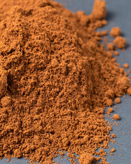 Top view of roasted coffee beans for background and texture. A pile of roasted and ground coffee beans can be used as a background and texture.