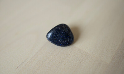 aventurine semi-precious stone on a light surface.astrology, a talisman for the Virgo zodiac sign