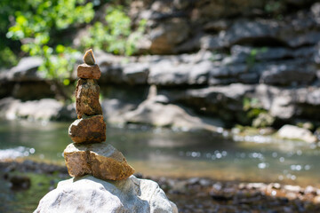 rocks stacked by creek