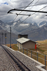 The Gornergratbahn a narrow gauge mountain rack railway approaching the Gornergrat summit station....