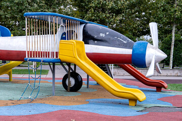 Outdoor children's playground, game equipments built in the form of an airplane.