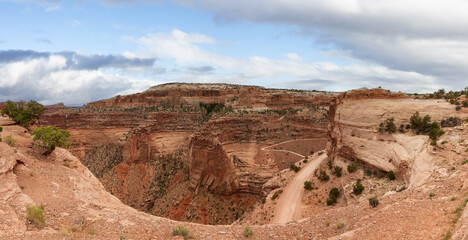 Scenic Panoramic View of American Landscape and Red Rock Mountains in Desert Canyon. Colorful Sky Art Render. Canyonlands National Park. Utah, United States. Nature Background Panorama