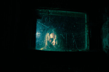 scary woman behind window  at night Halloween horror background